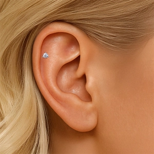 Close-up of S925 silver star bow stud earring with marquise moissanite on the ear helix