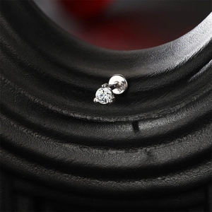 Macro shot of S925 sterling silver star stud earring with marquise moissanite and flat back