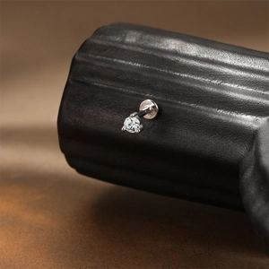 Macro shot of S925 sterling silver screw back stud featuring a round cut moissanite stone