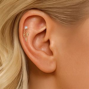 Detail of S925 silver star moon helix stud with gold tassel and sparkling crystal