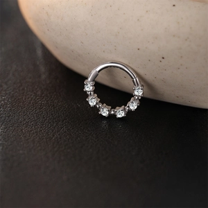 Macro shot of silver S925 sterling silver hoop with six sparkling moissanite stones