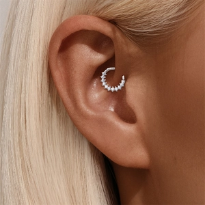 Detail view of s925 sterling silver daith hoop ring with sparkling moissanite stones