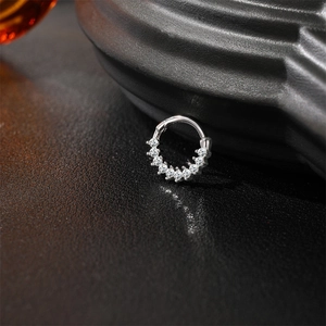 Close-up of S925 sterling silver hoop with nine sparkling pavé-set moissanite stones