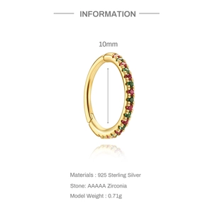 Detail of 925 sterling silver 10mm gold hoop earring with red and green zircon stones