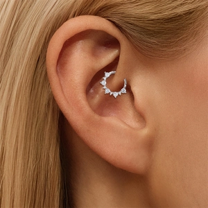 Detailed close-up of a silver S925 sterling silver ear hoop with sparkling cubic zirconia