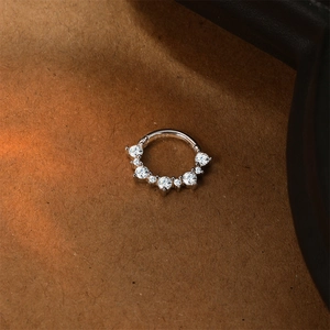 Macro shot of S925 sterling silver piercing ring with brilliant gradient moissanite stones