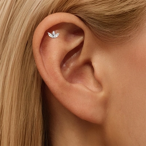 Macro shot of S925 sterling silver marquise stud earring worn on the ear helix