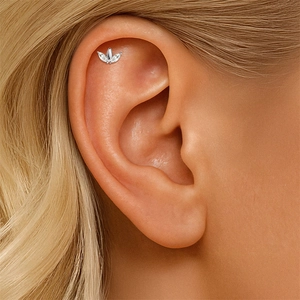 Detail of S925 silver marquise-cut helix stud earring worn on model's ear cartilage