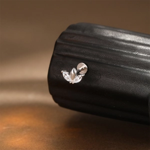 Close-up of S925 silver marquise-cut marquise zircon labret stud on textured surface