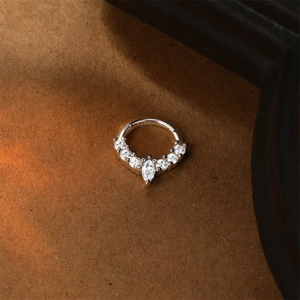 Macro view of S925 sterling silver clicker ring with marquise and round cubic zirconia