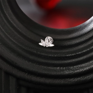 Macro shot of marquise-cut stones in s925 silver stud earring with leaf-shaped setting