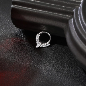 Macro shot of S925 sterling silver septum ring with marquise cut cz stones on leather
