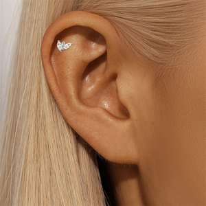 Macro shot of S925 sterling silver marquise cut moissanite earring worn on ear helix