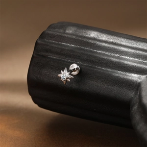 Macro shot of S925 sterling silver star stud with moissanite and flat back screw