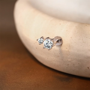 Macro shot of S925 sterling silver labret stud featuring double moissanite stones and flat back