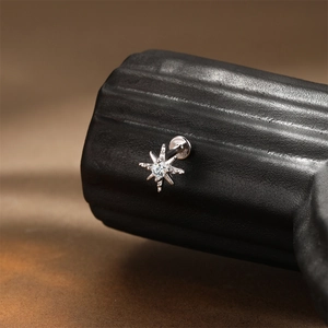 Detailed close-up of S925 sterling silver star-shaped stud with clear moissanite stone