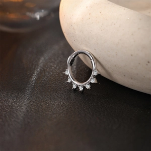 Macro view of silver S925 sterling silver hinged ring with heart-shaped zircon stones
