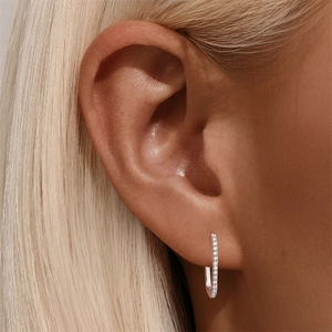 Close-up of S925 sterling silver U-shaped earrings with shimmering moissanite inlay