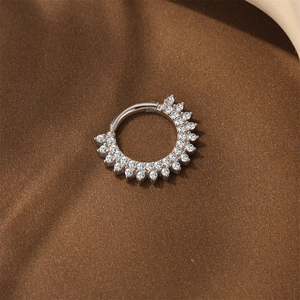 Detail view of silver hinged hoop earring with double rows of sparkling moissanite stones