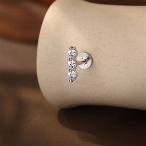 Close-up of S925 sterling silver piercing stud with three vertical sparkling zircons