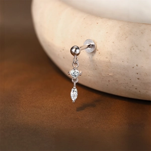 Macro shot of s925 silver flat back cartilage stud with round and marquise cut moissanite stones