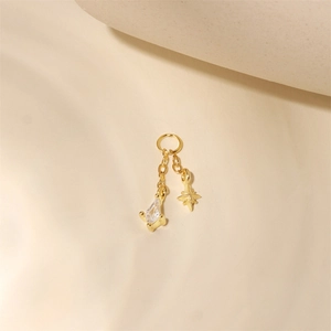 Close-up of gold S925 silver star and zircon pendant with delicate dangling chains