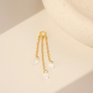 Detail of gold star butterfly tassel earring parts with cubic zirconia teardrops