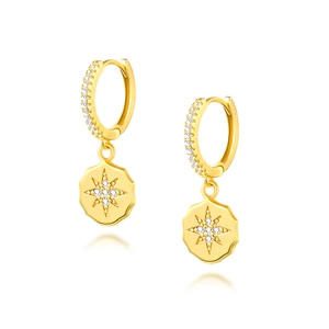 Detail of gold S925 silver huggie earrings featuring sparkling star pendant with zircons