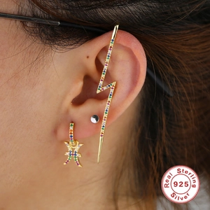 Detail of S925 sterling silver lightning ear cuff and Pisces charm earring set