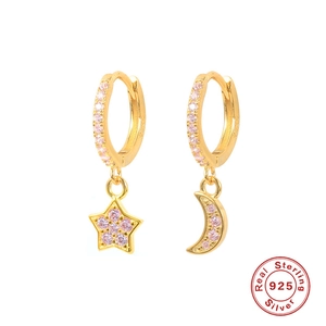 Detailed view of S925 sterling silver star and moon earrings with pink pavé zircons