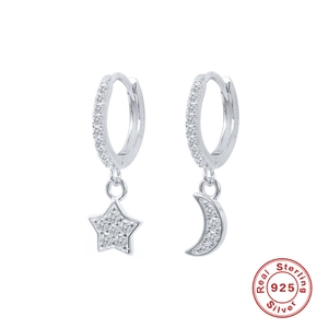 Detailed view of S925 sterling silver star and moon earrings with pavé cubic zirconia