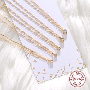 Five pieces of S925 sterling silver gold plated necklaces with round solitaire pendants