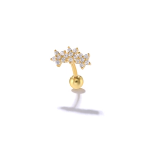 Detailed view of gold S925 silver triple star ear piercing with shimmering zircon stones