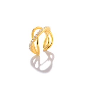Detailed macro view of the gold pavé-set crossover ear cuff fashion jewelry design.