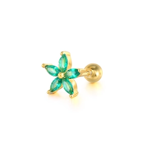 Detailed macro view of a golden flower stud earring with five green zircon stones