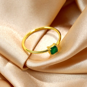 Luxury 18k gold plated S925 silver ring with square cut emerald gemstone on silk background