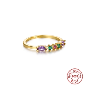 Luxurious S925 sterling silver gold ring with colorful geometric crystals in a white background