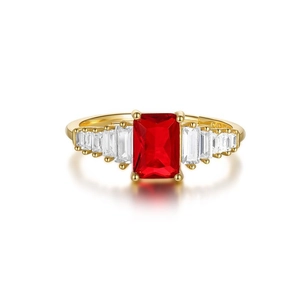 Detail of the rectangular red gemstone and baguette-cut side stones on gold ring