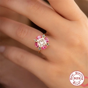 Luxury S925 sterling silver ring with square clear stone and pink oval gems on model hand