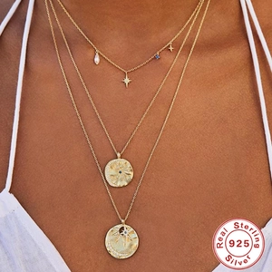 Layered S925 sterling silver star and pearl necklace with sun and moon gold charms