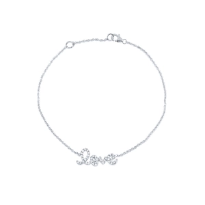 Macro view of 925 sterling silver Love charm bracelet with sparkling micro-pave diamonds