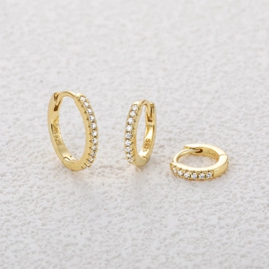 Detailed view of three sizes of gold S925 silver hoop earrings with small zircon stones