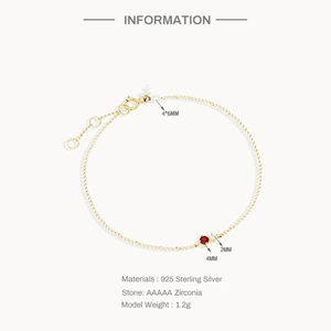 Detail of 925 sterling silver gold bracelet with 4mm red and 2mm white zirconia