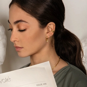 Golden earrings and layered necklace set with moon charms and zircon stones
