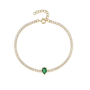Detail of gold tennis bracelet with white CZ stones and a green pear-cut drop stone