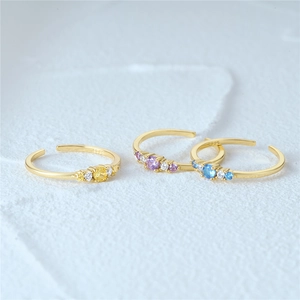 Close-up of S925 sterling silver open rings with colorful round gemstone centerpieces