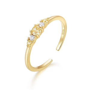 Detailed close-up of S925 silver gold-plated ring featuring five yellow and white gemstones