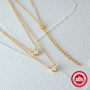 Double-layered S925 sterling silver necklace with sparkling round zircon pendants in gold finish