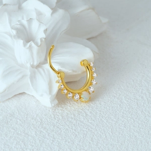 Close-up of S925 silver nose ring featuring marquise-cut opal and sparkling cubic zirconia