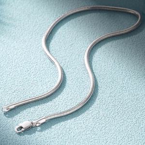 Detailed macro view of 925 sterling silver snake chain texture with clear S925 hallmark